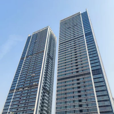 Twin Foshan Tianyue high-rise apartment towers during final unitized facade works