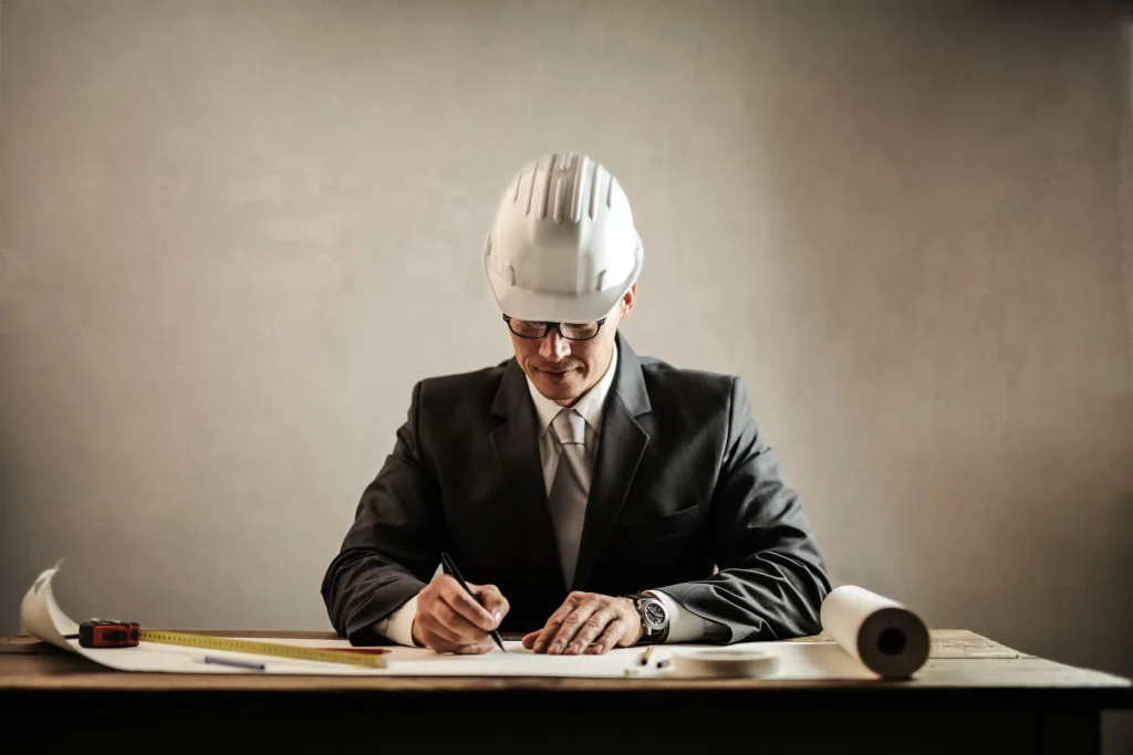 Engineer reviewing a large-format technical drawing