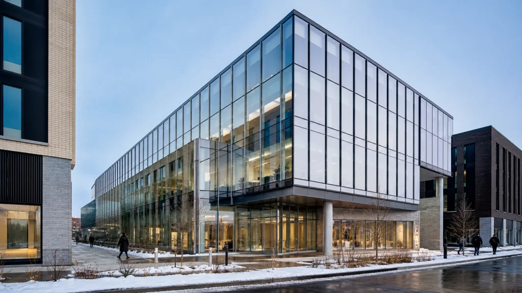 North American mixed-use building with a thermally efficient glass curtain-wall facade in winter