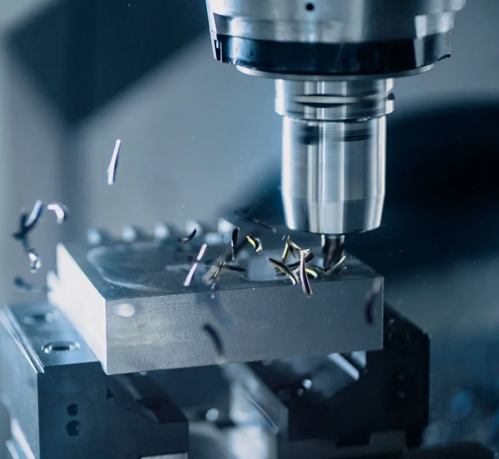CNC machining centre cutting an aluminium component in a curtain wall workshop
